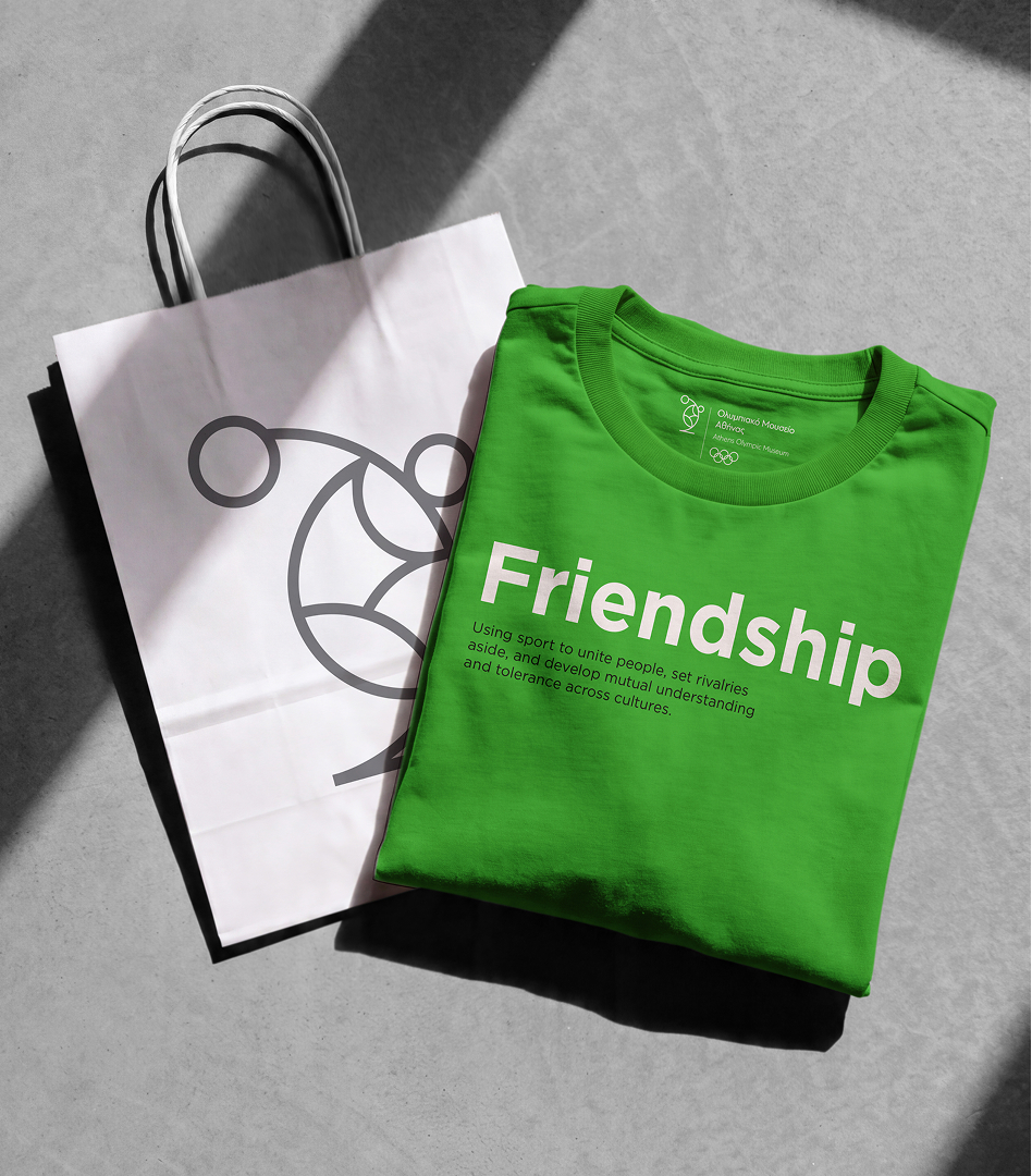 A folded green t-shirt printed with the word 